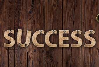 SUCCESS letters nailed to a wall