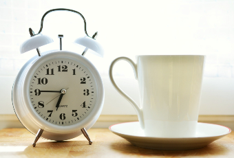 Alarm clock and cup of tea