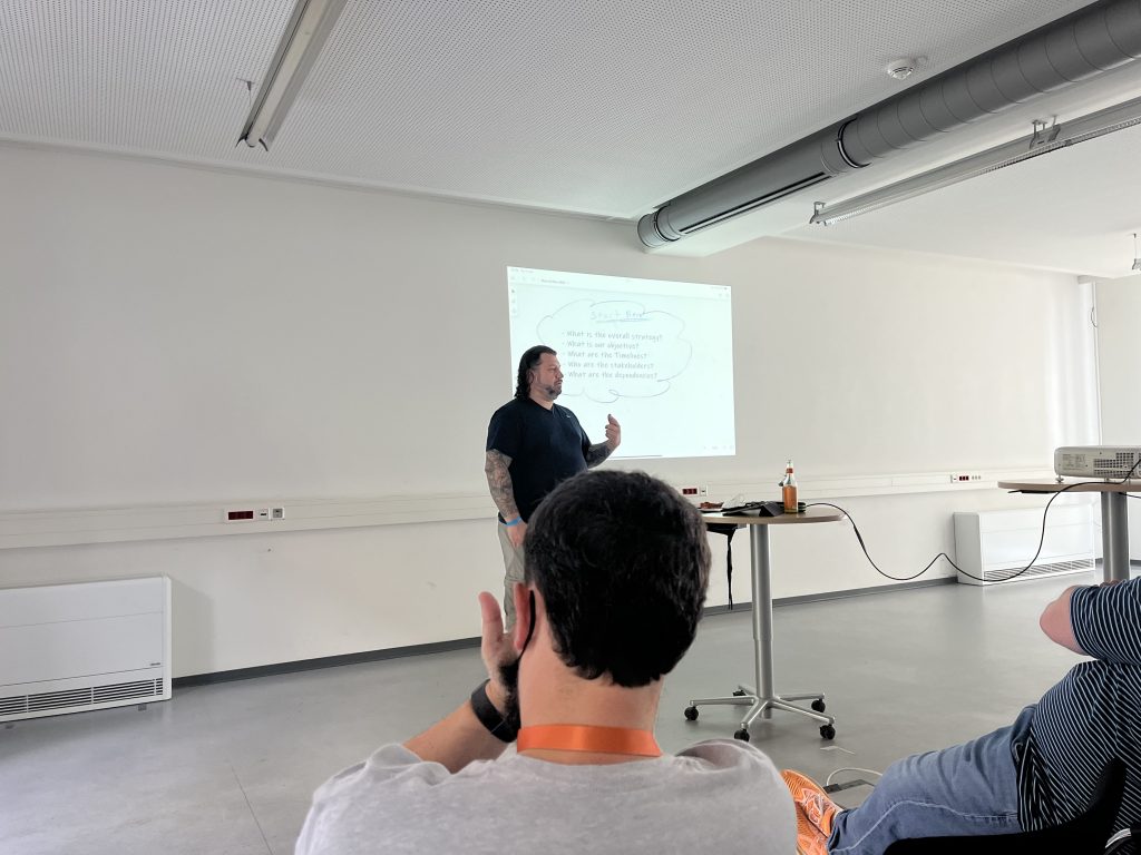 John Martin speaks to the room