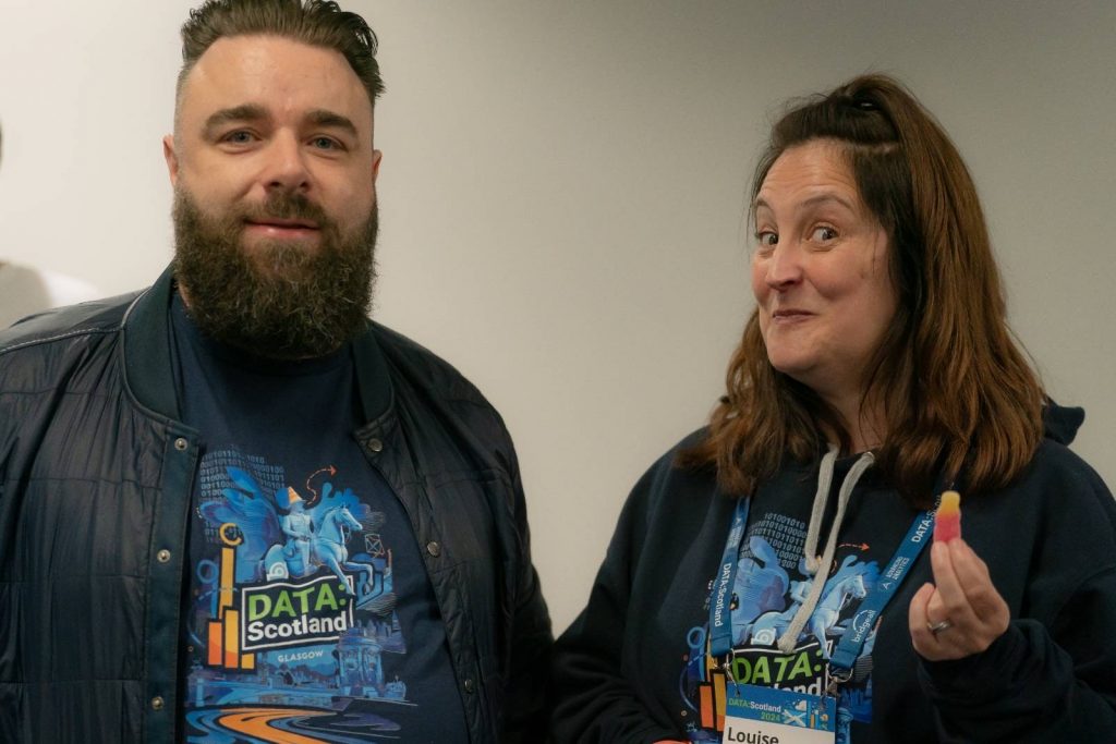 John and Louise at the registration desk